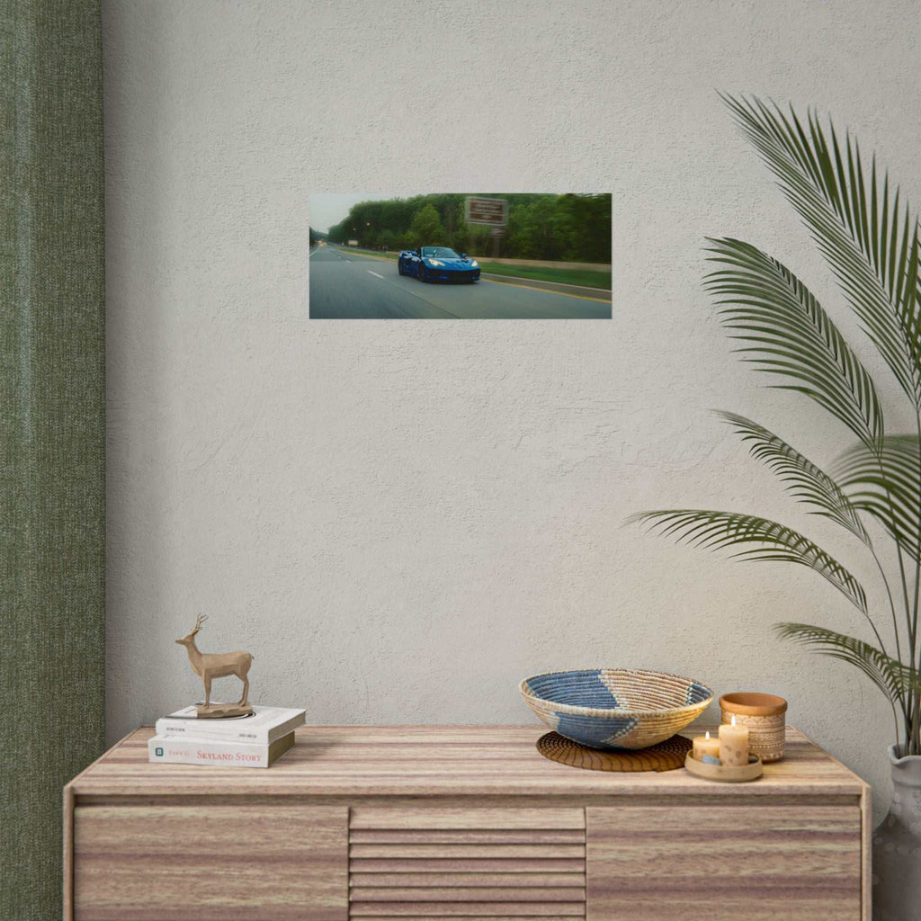 C8 Corvette Stingray blue sports car speeding on a tree-lined highway poster with motion blur and deep blues