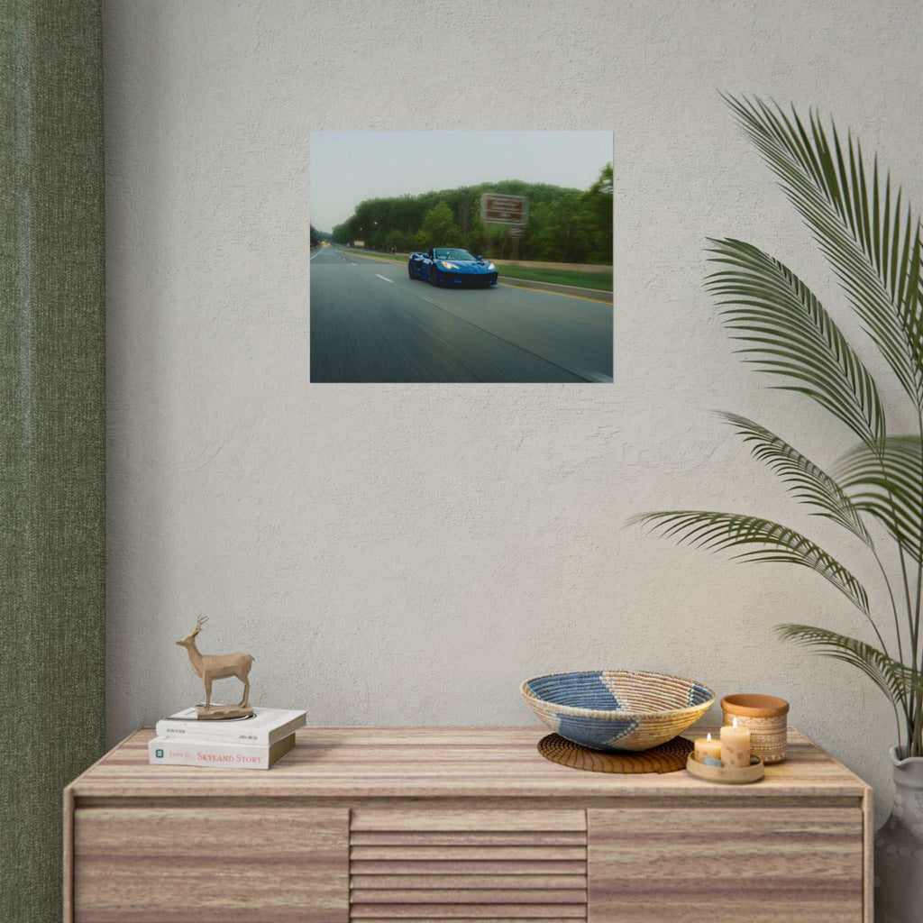 C8 Corvette Stingray poster featuring a blue sports car speeding on a tree-lined highway with motion blur
