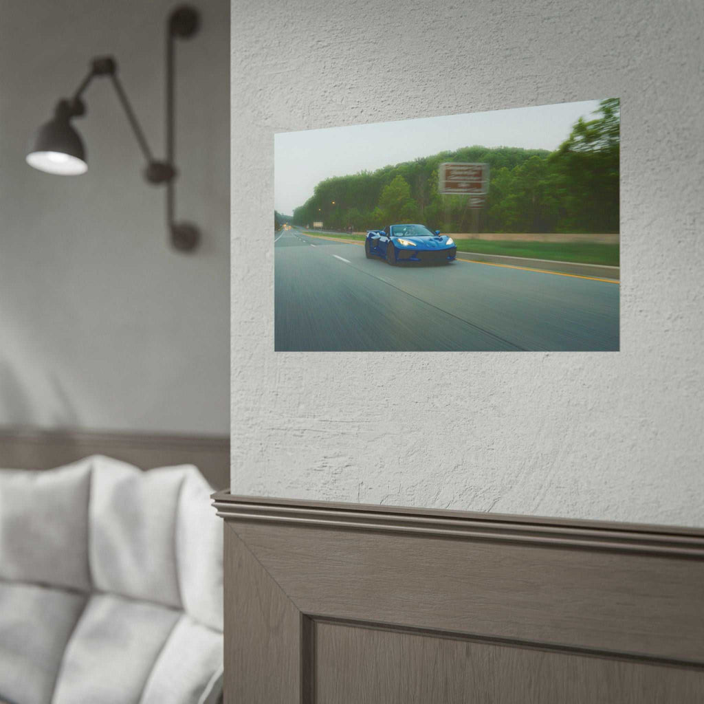 C8 Corvette Stingray blue sports car driving fast on a tree-lined highway with motion blur and vivid detail print