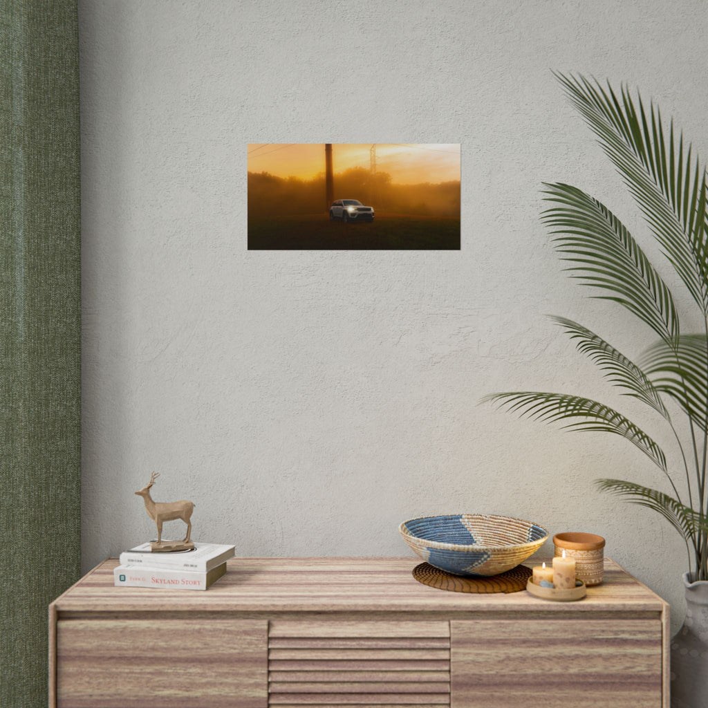 Jeep Grand Cherokee in a sunset fog print with warm amber hues and cinematic mist, framed in a cozy room setting