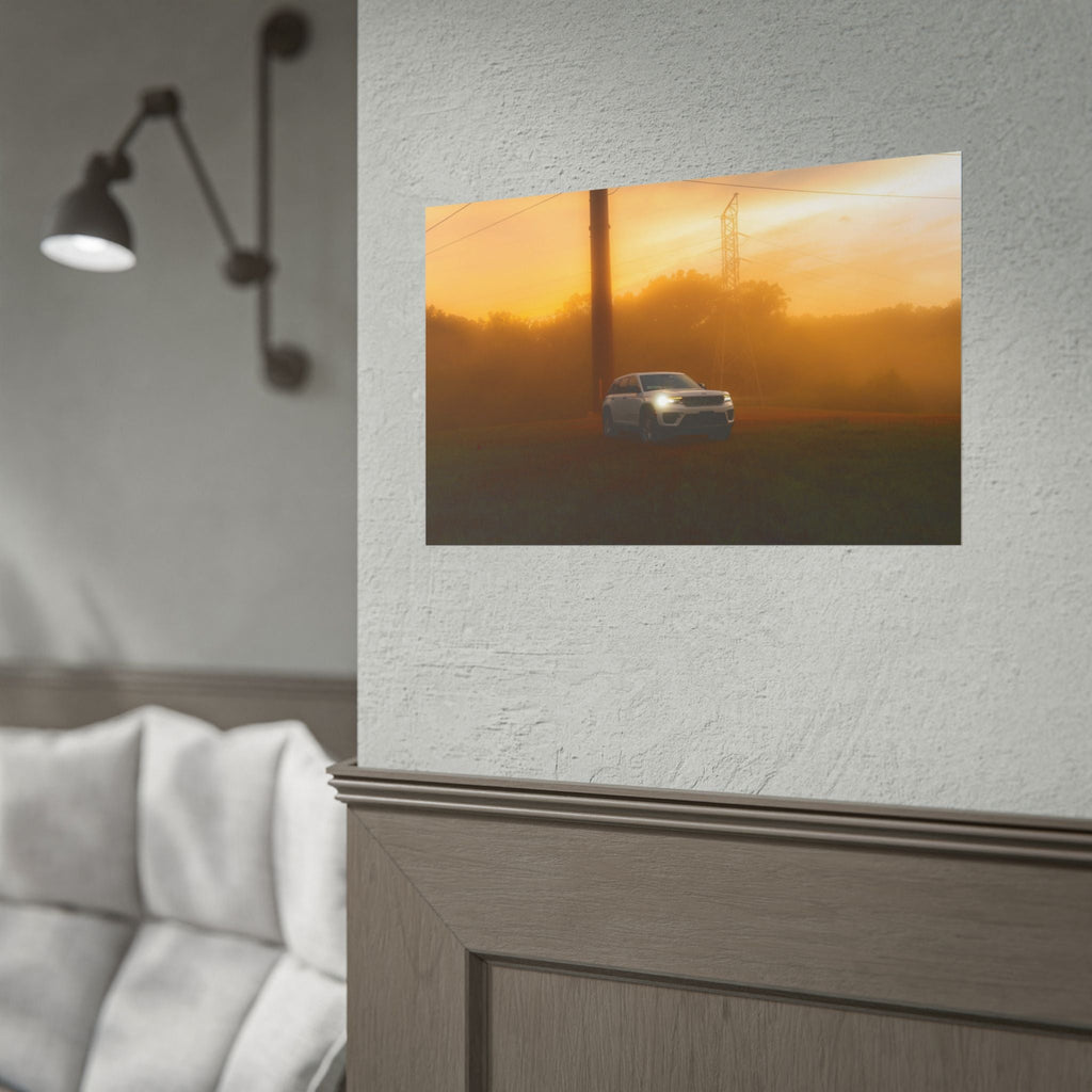 Jeep Grand Cherokee in white slicing through warm amber sunset fog with power lines in background, cinematic mood