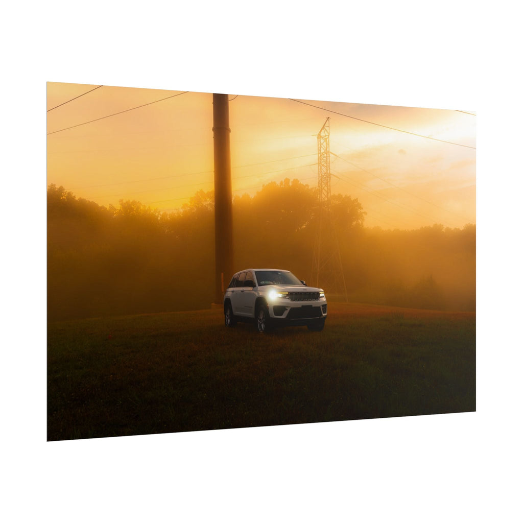 Jeep Grand Cherokee in white driving through warm amber sunset fog with power lines and misty trees