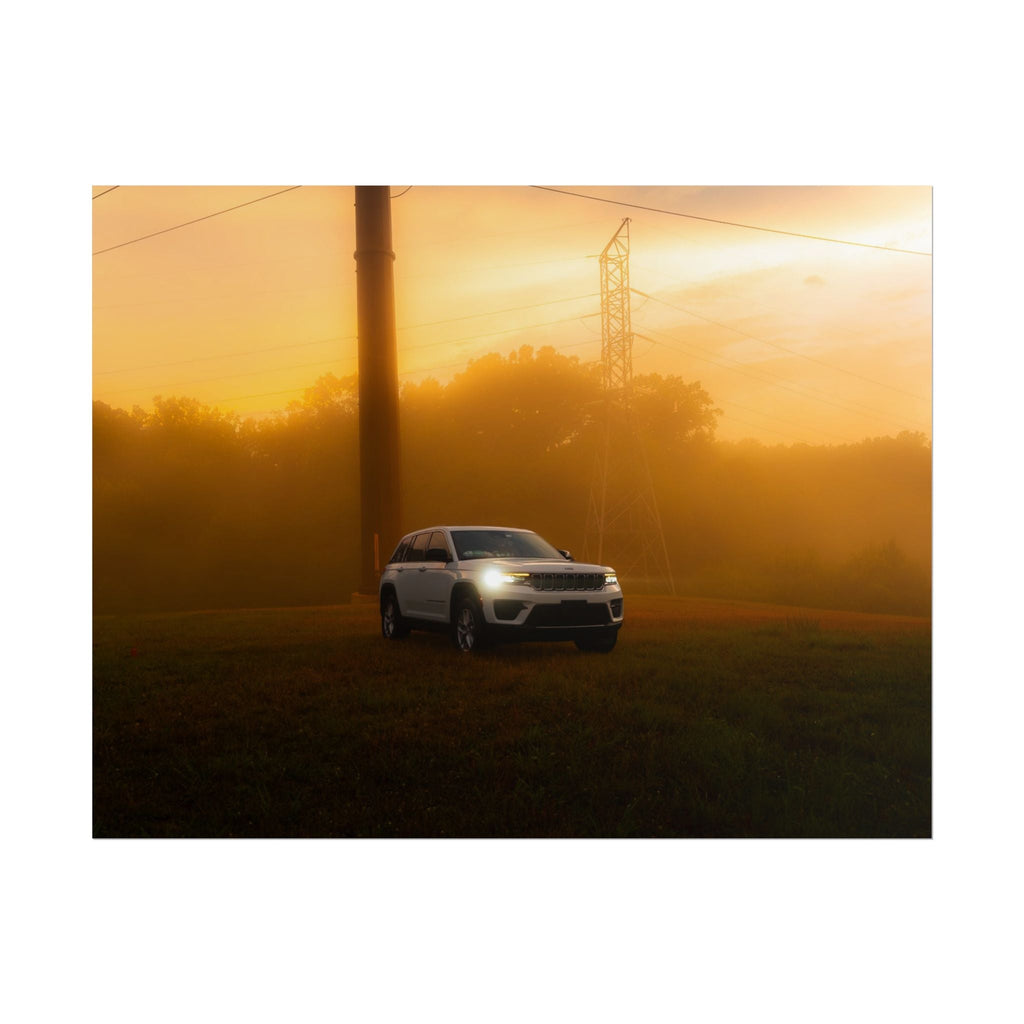 Jeep Grand Cherokee in white driving through warm orange sunset fog with power lines in background