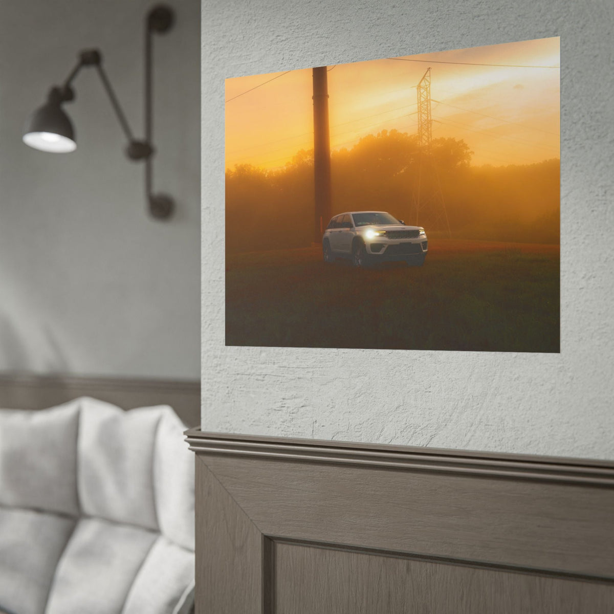 Jeep Grand Cherokee in a white color driving through an amber sunset fog with power lines in the background