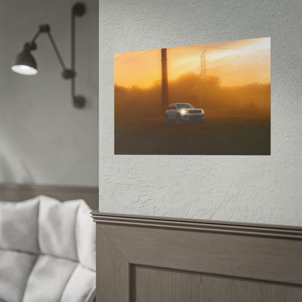 Jeep Grand Cherokee white SUV driving through warm, hazy sunset fog with amber light around headlights and power lines in background
