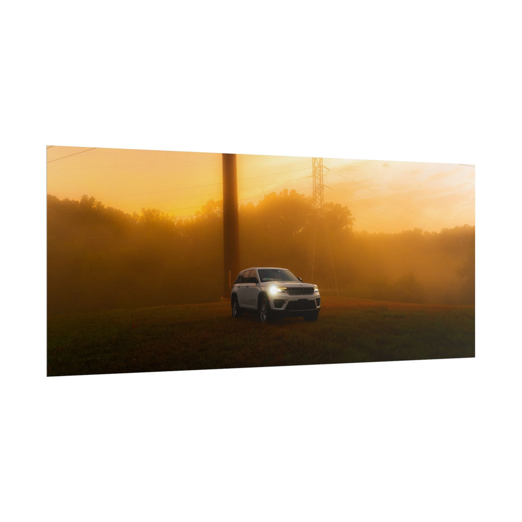 Jeep Grand Cherokee white SUV with headlights on driving through warm, hazy sunset fog surrounded by silhouetted trees and power lines