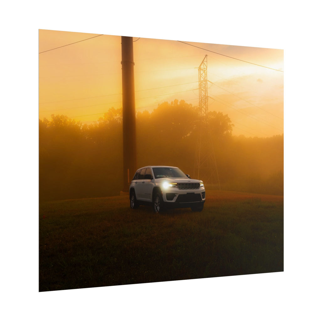 Jeep Grand Cherokee white SUV with headlights on in warm, hazy sunset fog with power lines and grassy field