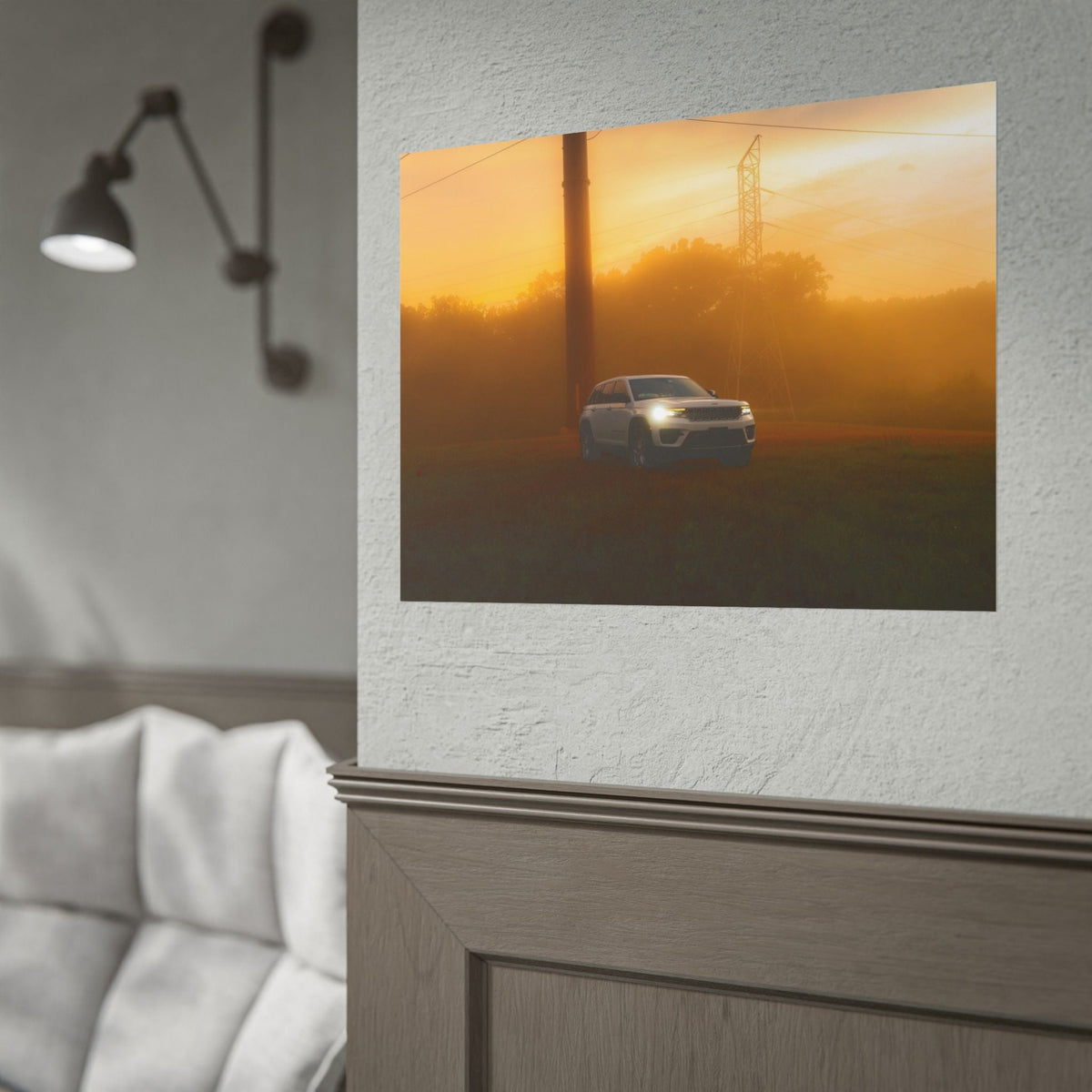 Jeep Grand Cherokee white SUV with headlights on driving through warm amber sunset fog with power lines in background