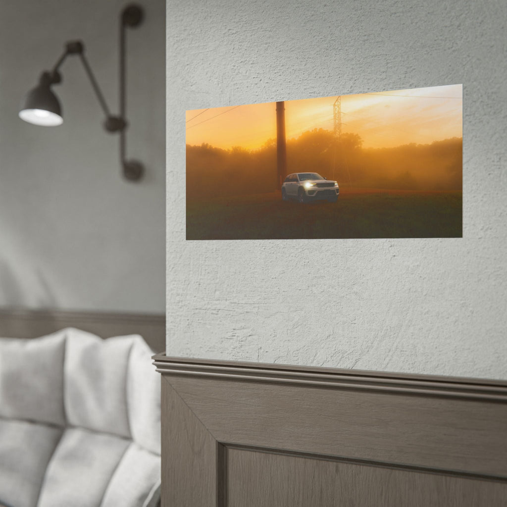 Jeep Grand Cherokee white vehicle driving through warm sunset fog with amber light and power lines in background